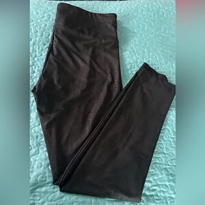 Black leggings with subtle snakeskin embossing print. Size large